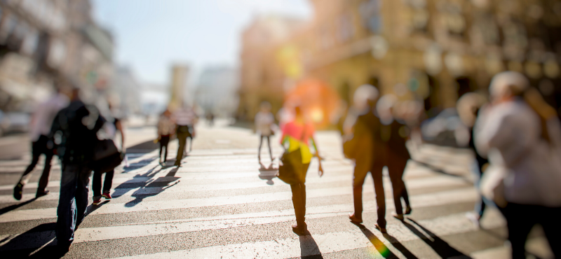 Blurry Image of a Crowd of People in a Crosswalk