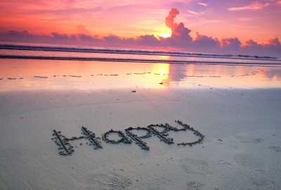 Happy-Written in the Sand at Sunset
